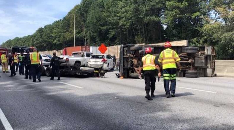 I-75 South was temporarily shut down Tuesday afternoon after a truck overturned in Clayton County, police said.