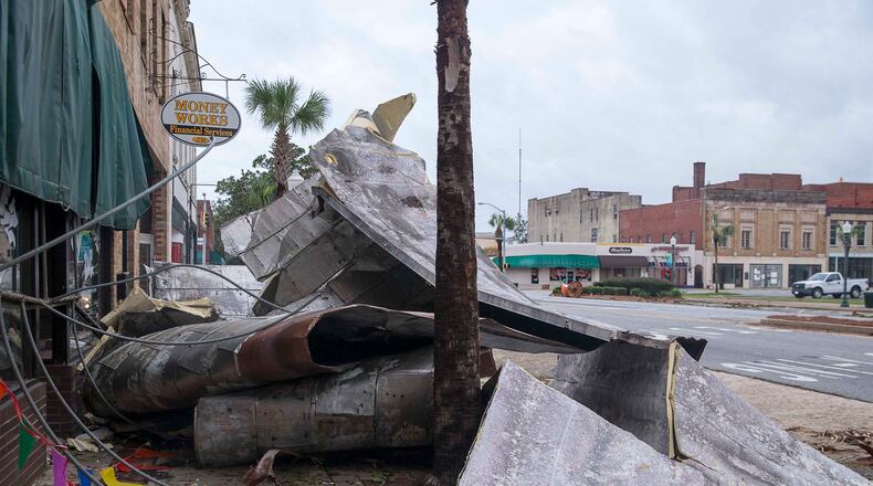 10/11/2018 -- Albany, Georgia -- Debris lines the sidewalks on West Broad Avenue in Albany following Hurricane Michael, Thursday, October 11, 2018. Hurricane Michael passed through Albany Wednesday evening as a Category 2 hurricane. (ALYSSA POINTER/ALYSSA.POINTER@AJC.COM)