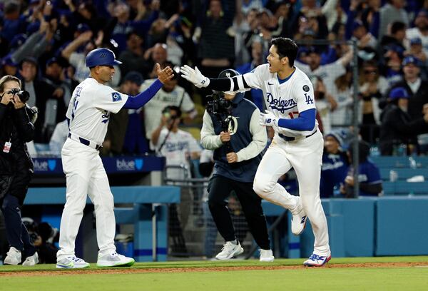 Shohei Ohtani celebrates his walk-off home run against the Braves.