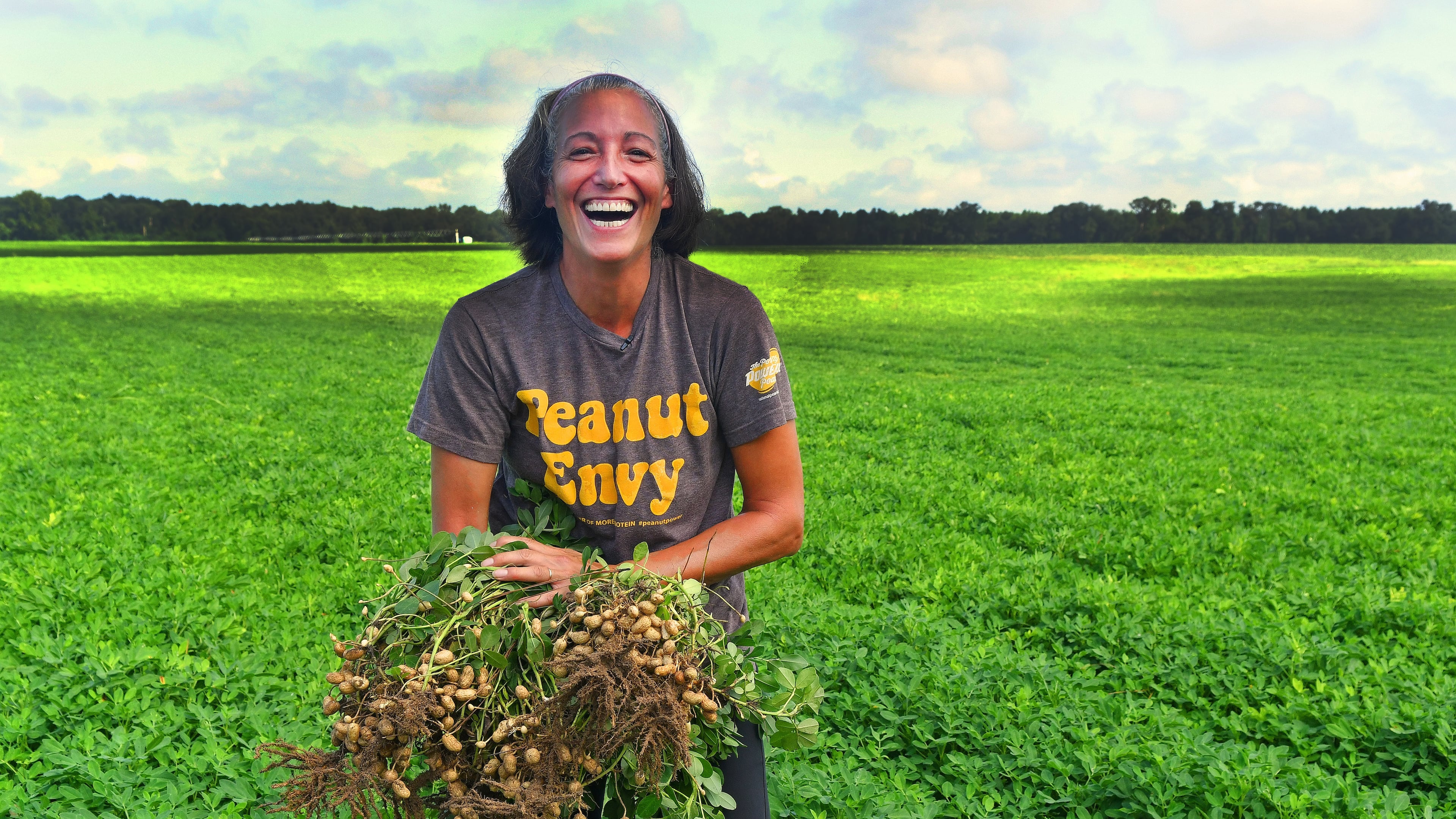 As part of the Georgia on My Plate series, food editor Ligaya Figueras hand-harvested a peanut plant on Longleaf Ridge Farms in August 2021. After a decade at the AJC, she officially retires today. (Chris Hunt for the AJC)
