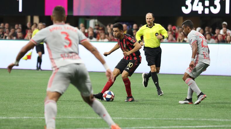 Atlanta United midfielder Gonzalo MartAnez (10) moves the ball during the first half in a MLS game against the New York City Red Bulls on Sunday, July 7, 2019, in Atlanta. BRANDEN CAMP/SPECIAL