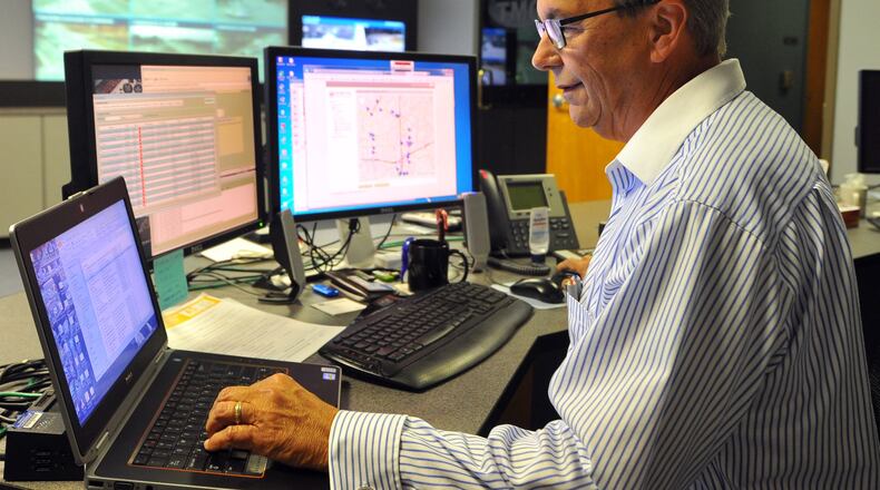 Bill Andrews monitors traffic from the Sandy Springs traffic management center Tuesday September 24, 2013.