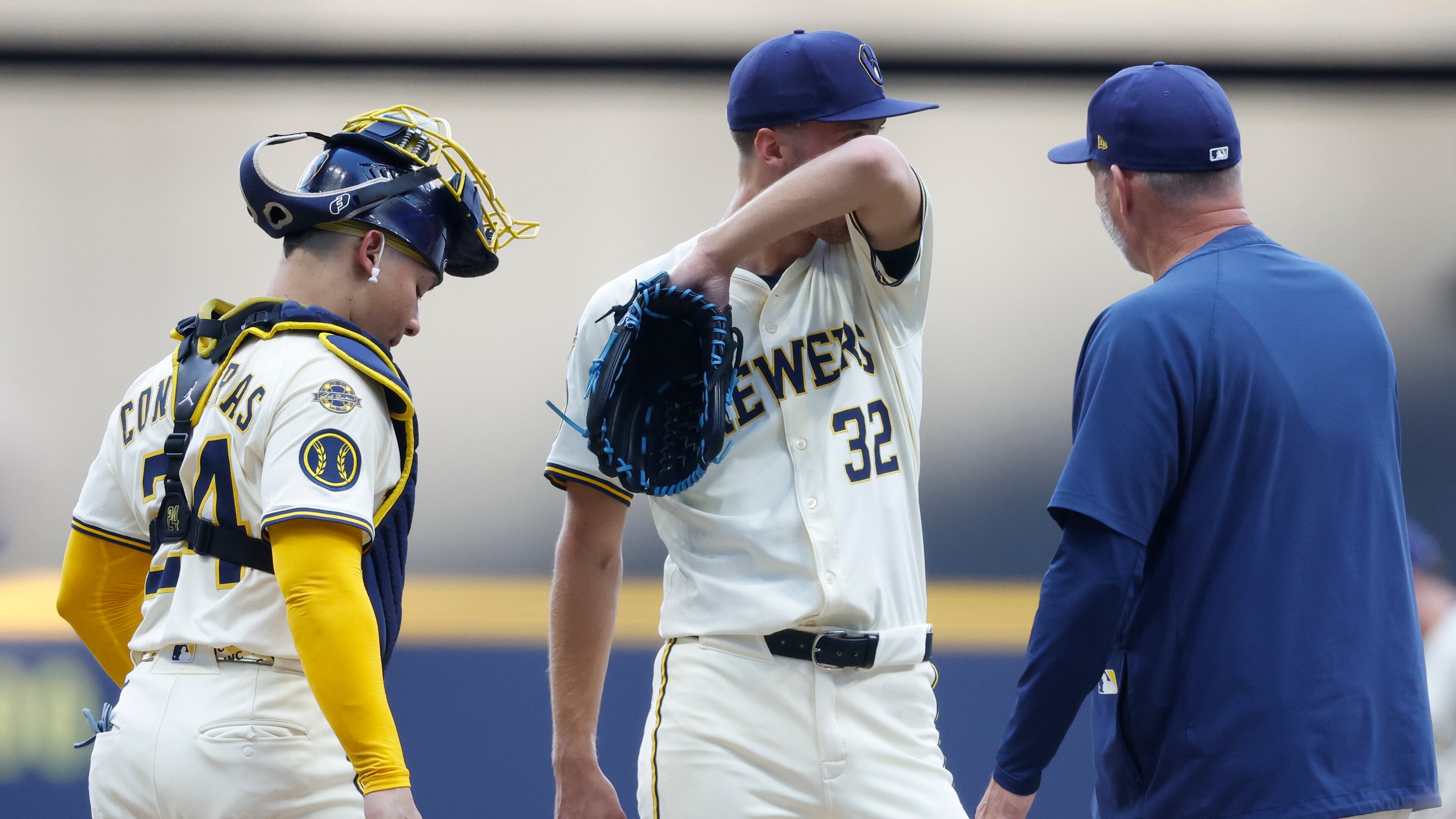 Milwaukee Brewers pitcher Jacob Misiorowski (32) wipes his face during a break in the action against the Chicago Cubs during the first inning of a baseball game, Monday, July 28, 2025, in Milwaukee. (AP Photo/Jeffrey Phelps)