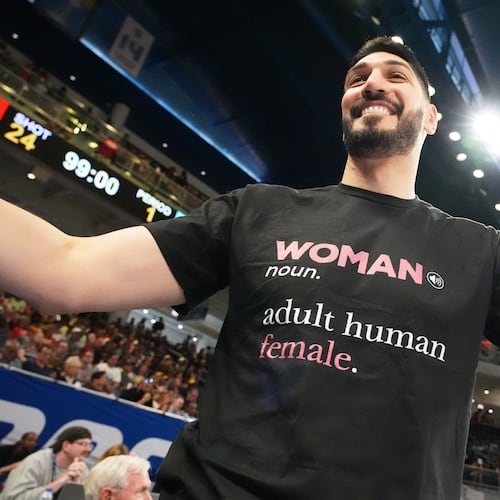 Former NBA center Enes Kanter Freedom greets a friend before a WNBA basketball game between the Indiana Fever and the Chicago Sky, Sunday, Aug. 23, 2026, in Chicago. (AP Photo/Nam Y. Huh)