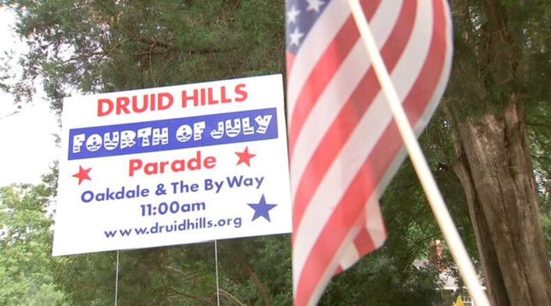 The organizers of an annal Fourth of July parade in Druid Hills say hundreds of American flags were stolen along the 1-mile route.