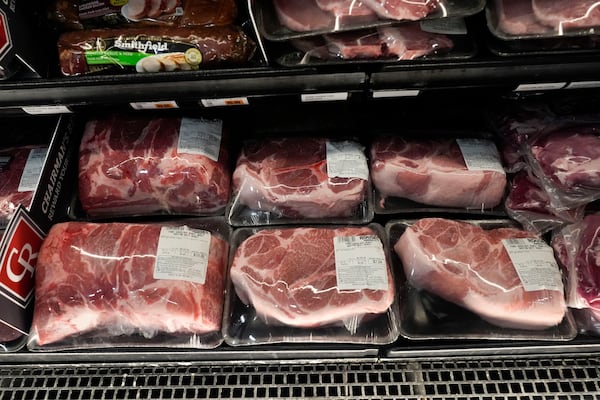 FILE - Pork products line the cooler at a grocery store in New Orleans, April 17, 2024. (AP Photo/Gerald Herbert, File)