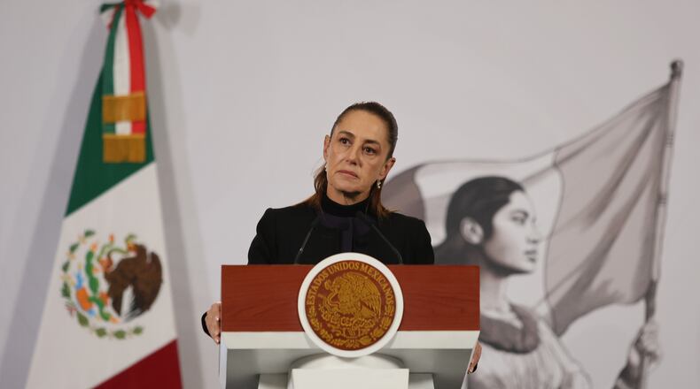 Mexican President Claudia Sheinbaum gives her the daily, morning news conference at the National Palace in Mexico City, Monday, Feb. 23, 2026, the day after the Mexican army killed Jalisco New Generation Cartel leader Nemesio Oseguera Cervantes, known as "El Mencho." (AP Photo/Ginnette Riquelme)
