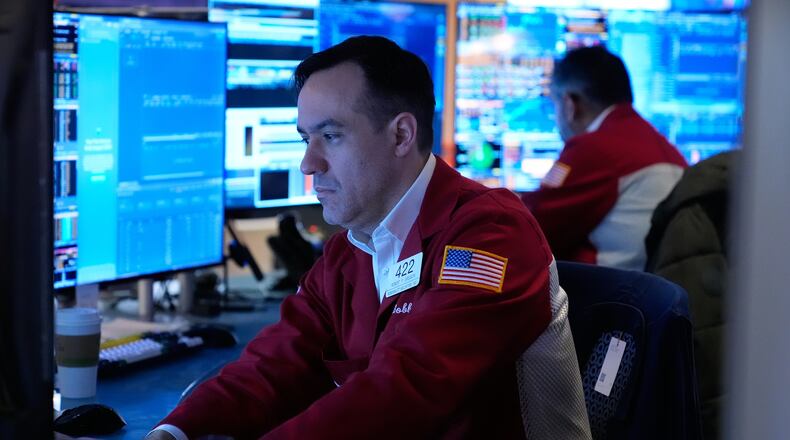 Robert Greason works on the floor at the New York Stock Exchange in New York, Tuesday, April 7, 2026. (AP Photo/Seth Wenig)