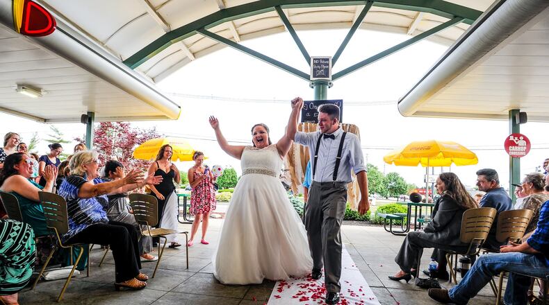 Chelsea Woods and Ronald Thompson were married Friday, June 3, at the same Sonic Drive-In where they met nine years ago on South Erie Boulevard in Hamilton. Many of the guests in attendance worked at Sonic at one time.