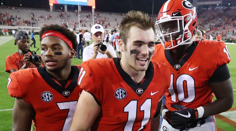Georgia quarterback Jake Fromm and teammates celebrate the 53-28 win over SEC rival Missouri Saturday, Oct. 14, 2017, in Athens.