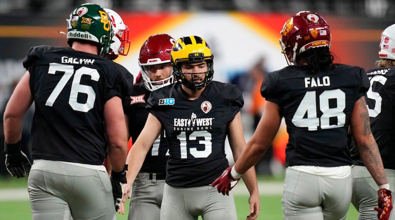 West kicker Jake Moody of Michigan, center, celebrates after making a field goal against East during the second half of the East-West Shrine Bowl NCAA college football game Thursday, Feb. 2, 2023, in Las Vegas. (AP Photo/John Locher)