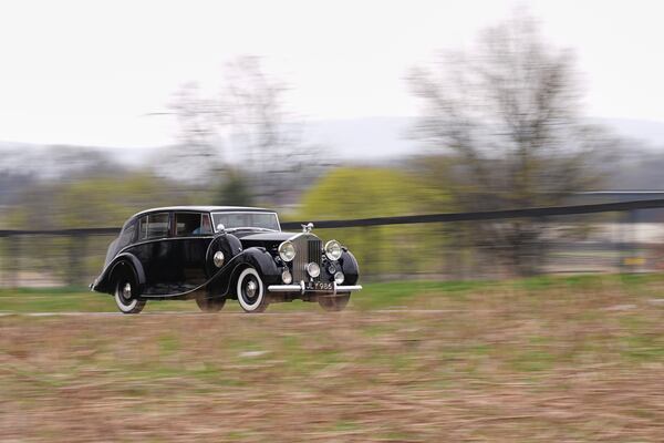 Mike Fowler drives a 1946 Rolls-Royce Silver Wraith from the The Rolls-Royce Foundation's collection in Mechanicsburg, Pa., Saturday, April 5, 2025. (AP Photo/Matt Rourke)