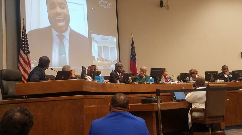 Odie Donald II, on screen, interviews for the job of South Fulton city manager over Skype in a public meeting Tuesday. ARIELLE KASS / AKASS@AJC.COM