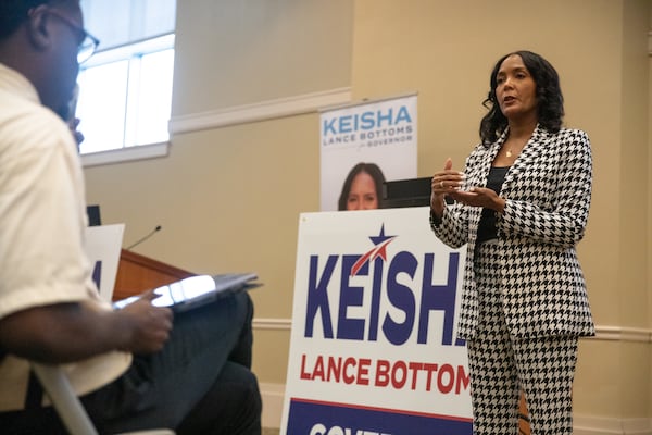 Democratic nominee for governor Keisha Lance Bottoms speaks with voters at the Columbus Public Library last month. (Riley Bunch/AJC)