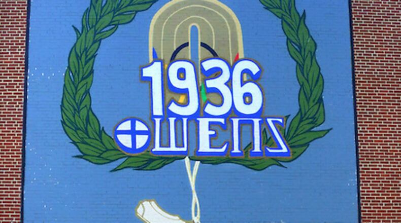 A mural honoring Olympic track star Jesse Owens was unveiled April 21 at KIPP Atlanta Collegiate school in northwest Atlanta. Led by Eric Mack, an art teacher at KIPP Strive Primary, students from several KIPP area schools collaborated on the mural. CONTRIBUTED BY CAROLYN SLOSS