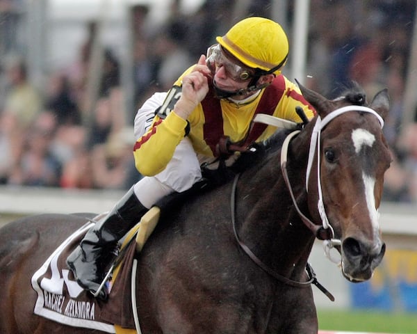 FILE - Jockey Calvin Borel gestures as he rides Rachel Alexandra to victory in the 134th running of the Preakness Stakes horse race at Pimlico Race Course, Saturday, May 16, 2009, in Baltimore. (AP Photo/Garry Jones, File)