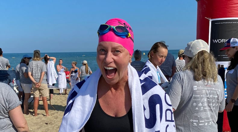 Marietta's Vicki Bunke swims to raise money for cancer research in the name of her late daughter, Grace.