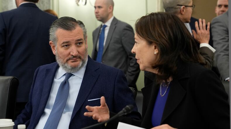 FILE - Senate Commerce, Science, and Transportation Committee Chair Sen. Ted Cruz, R-Texas, left, talks with ranking member Sen. Maria Cantwell, D-Wash., right, before the start a hearing on Capitol Hill in Washington, Wednesday, Jan. 15, 2025. (AP Photo/Susan Walsh,File)