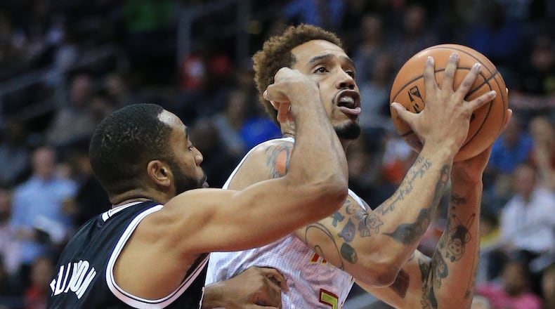 Hawks’ Mike Scott is fouled by Nets Wayne Ellington on his way to the basket during the first period in a basketball game on Wednesday, Nov. 4, 2015 in Atlanta. Curtis Compton / ccompton@ajc.com