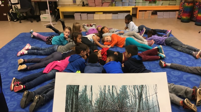 Incorporating arts into their coursework, students at Henderson Mill Elementary recreate form the image of a wreath. The Northlake area school recently earned the first STEAM certification in the state. Contributed.