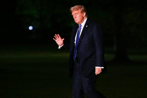 President Donald Trump waves as he arrives on the South Lawn of the White House, Thursday, April. 24, 2025, in Washington. (AP Photo/John McDonnell)