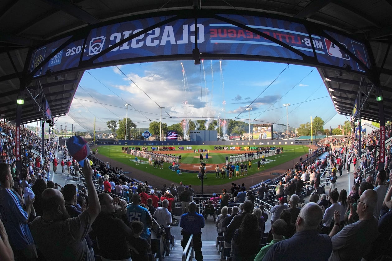 In this photo taken with a fisheye lens, fans fill the ballpark for the opening ceremony before the Little League Classic baseball game between the Milwaukee Brewers and the Atlanta Braves at Bowman Field in Williamsport, Pa., Sunday, Aug. 23, 2026. (Gene J. Puskar/AP)