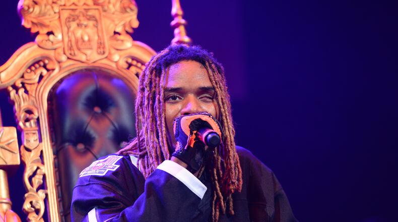 FILE - In this Oct. 22, 2015 file photo, rapper Fetty Wap performs at Power 105.1's Powerhouse 2015 at Barclays Center in New York. Fetty Wap tossed wads of cash over a balcony at a New Jersey mall to the delight of onlookers. Videos posted to social media show the Paterson, N.J., native throwing money as he walked through the Garden State Plaza mall in Paramus on Saturday, Nov. 21. The rapper posted on Twitter that he was so happy to be shopping with his daughter that he threw $2,000 to fans. (Photo by Scott Roth/Invision/AP, File)