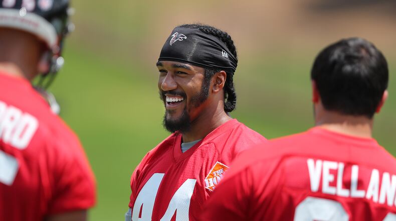 Falcons pass rusher Vic Beasley Jr. shares a laugh with teammates taking the field for the first day of mini-camp on Tuesday, June 13, 2017, in Flowery Branch.     Curtis Compton/ccompton@ajc.com