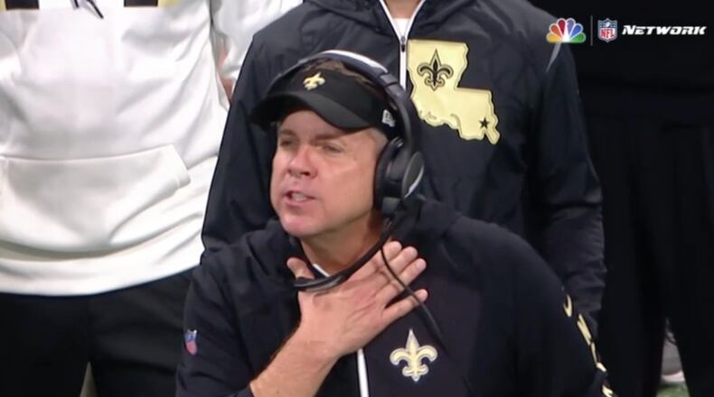 New Orleans Saints coach Sean Payton makes the "choke" sign during a game with the Atlanta Falcons.