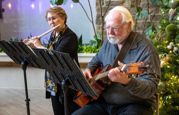 Barb Russell and Dave Walter typically perform three days a week — sometimes five at Christmas. They have no plans to stop anytime soon, Russell said. (Phil Skinner for the AJC)