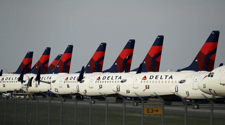 Several dozen mothballed Delta Air Lines jets sit, a sign of how much of the economy has been idled by efforts to slow spread of the coronavirus. (AP Photo/Charlie Riedel)