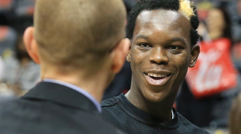 102715 ATLANTA: -- Hawks guard Dennis Schroder shares a laugh with general manager Wes Wilcox during pregame warmups for the first regular season basketball game "home opener" on Tuesday, Oct. 27, 2015, in Atlanta. Curtis Compton / ccompton@ajc.com