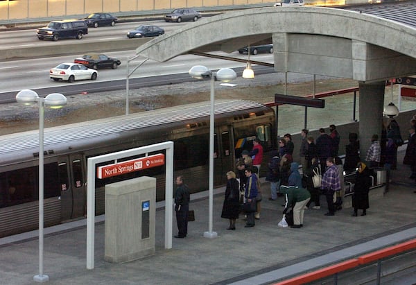 Commuters wait for a MARTA train's arrival at the North Springs station in December 2000. The North Springs and Sandy Springs stops were MARTA's last new stations. (Sunny Sung/AJC 2000)
