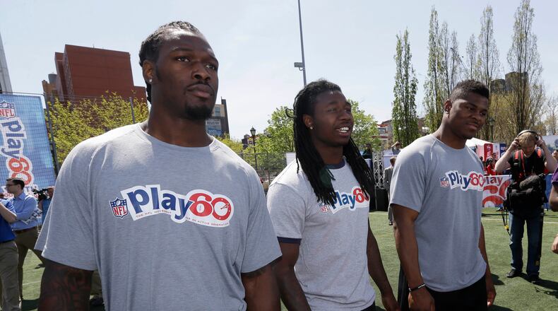 South Carolina's Jadeveon Clowney, left, Clemson's Sammy Watkins, center, and Buffalo's Khalil Mack participate in an NFL event in New York, Wednesday, May 7, 2014. The event was to promote Play 60, an NFL program which encourages kids to be active for a healthy life. (AP Photo/Seth Wenig) Jadeveon Clowney , left, Sammy Watkins, center, and Khalil Mack may be the top three players drafted tonight. (AP photo)
