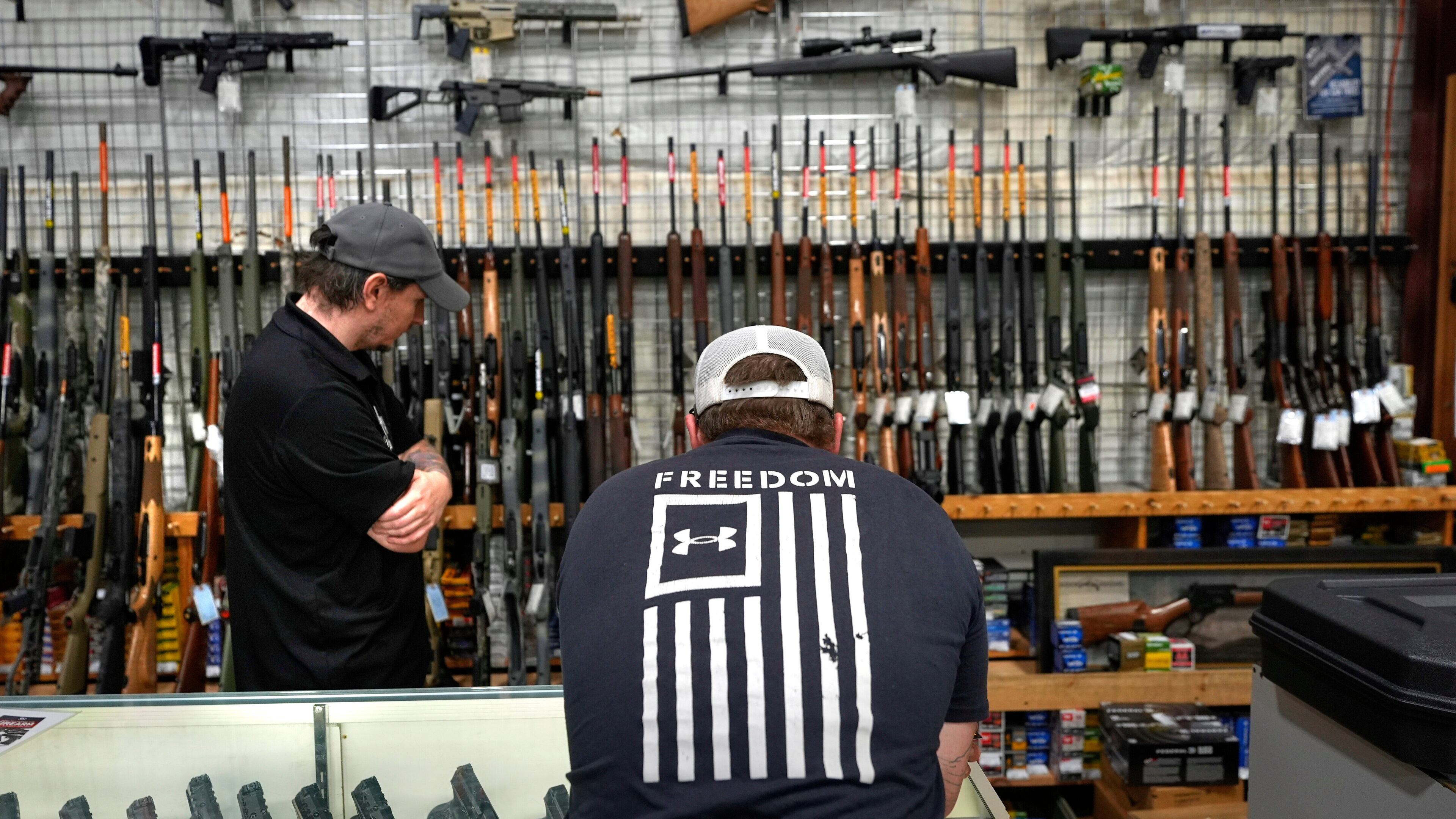A customer shops at Maine Military Supply, Tuesday, Nov. 4, 2025, in Holden, Maine. (AP Photo/Robert F. Bukaty)