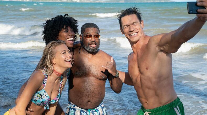 From left, Meredith Hagner, Yvonne Orji, Lil Rel Howery and John Cena in "Vacation Friends." (Jessica Miglio/20th Century Studios/Hulu/TNS)