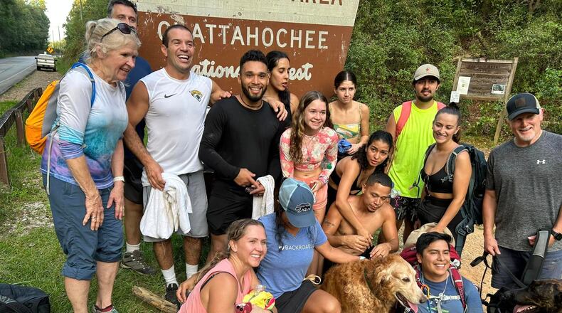 A group of 13 strangers helped the Santanas get their dog, Prince, down the mountain when the dog couldn't finish their hike. Courtesy of Cheryl Hite