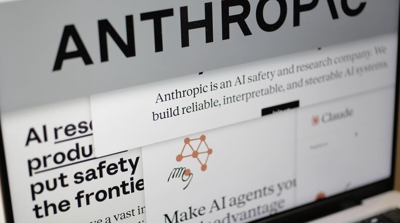FILE - Pages from the Anthropic website and the company's logo are displayed on a computer screen in New York on Feb. 26, 2026. (AP Photo/Patrick Sison, File)