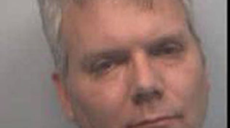 Robert M. Cook, of Fairburn, was arrested in connection with the shooting death of police Lt. Mike Vogt, 56.