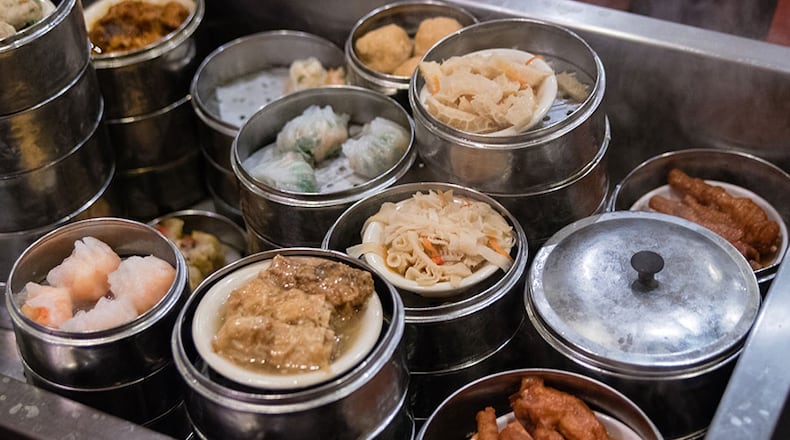 Dim sum carts billow steam as they're wheeled between the tables at Royal China in Chamblee. CONTRIBUTED BY HENRI HOLLIS