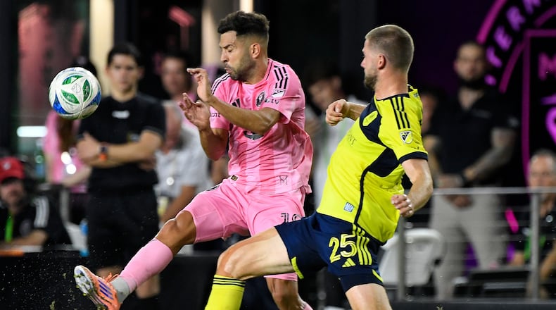 Nashville defender Walker Zimmerman (right) — pictured challenging Inter Miami's Jordi Alba during the MLS playoffs last month — seem like he would be a good fit with Atlanta United, but his salary is likely too high. (Michael Laughlin/AP)