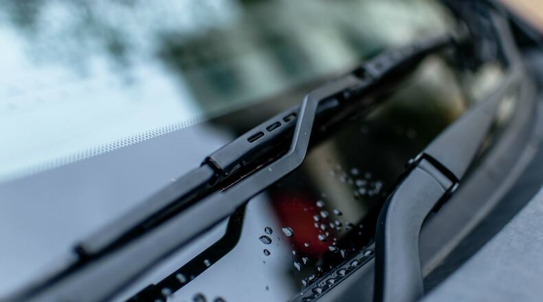 FILE PHOTO: A snake surprised a driver and his passenger Tuesday when it slithered along their SUV then across their windshield before being flung from the vehicle by the wipers.