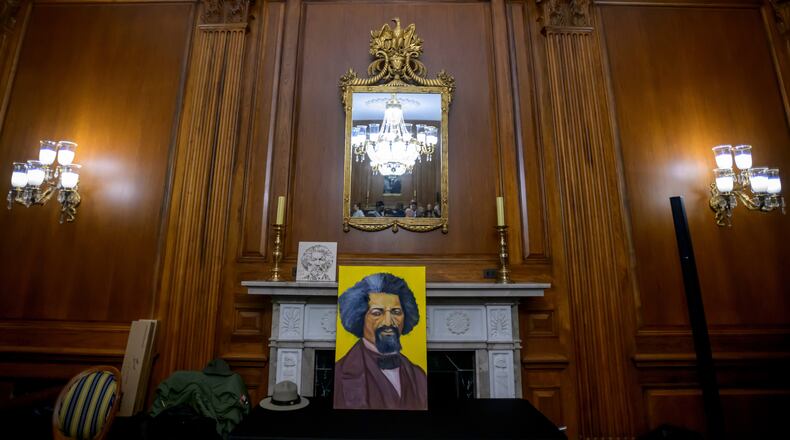 Artwork portraying Frederick Douglass rests on a table during a formal dedication of the House Press Gallery to be named after Frederick Douglass on Capitol Hill, Thursday, Feb., 12, 2026, in Washington. (AP Photo/Rod Lamkey, Jr.)