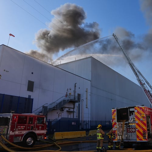 Crews work a warehouse fire in the Boyle Heights section of Los Angeles on Wednesday, June 17, 2026. (AP Photo/Jae C. Hong)