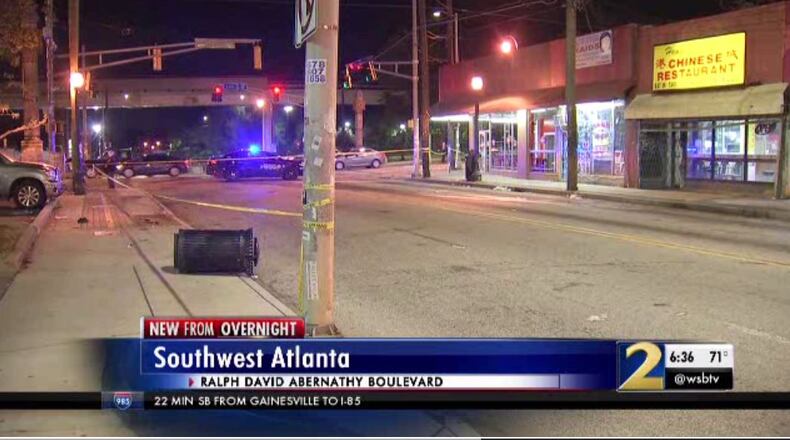 Police investigate a crash at the intersection of Ralph David Abernathy Boulevard and Lee Street in southwest Atlanta Sunday night.