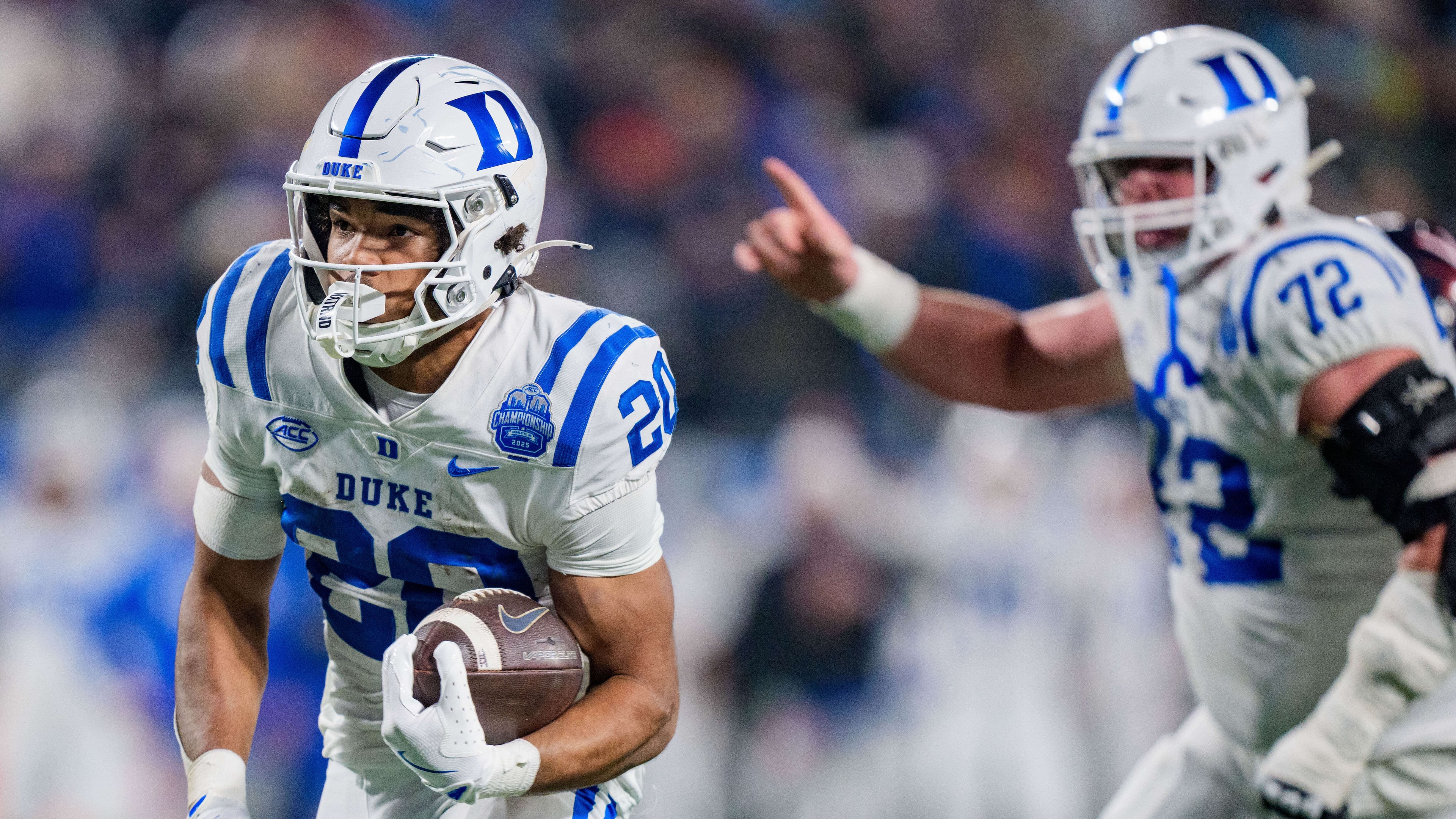 Duke running back Nate Sheppard (20) runs for a touchdown in the first half of the Atlantic Coast Conference championship NCAA college football game against Virginia, Saturday, Dec. 6, 2025, in Charlotte, N.C. (AP Photo/Jacob Kupferman)