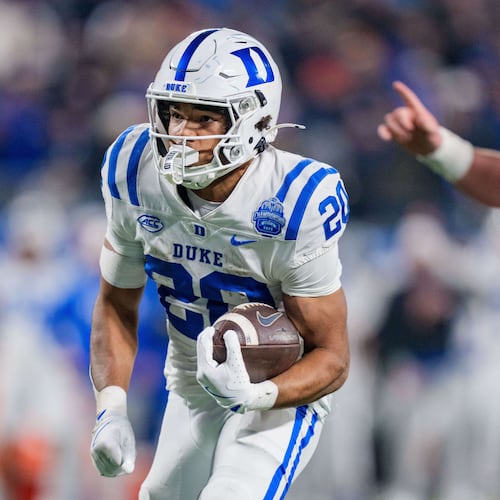 Duke running back Nate Sheppard (20) runs for a touchdown in the first half of the Atlantic Coast Conference championship NCAA college football game against Virginia, Saturday, Dec. 6, 2025, in Charlotte, N.C. (AP Photo/Jacob Kupferman)