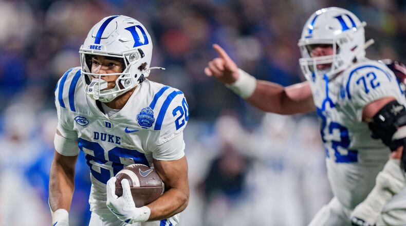 Duke running back Nate Sheppard (20) runs for a touchdown in the first half of the Atlantic Coast Conference championship NCAA college football game against Virginia, Saturday, Dec. 6, 2025, in Charlotte, N.C. (AP Photo/Jacob Kupferman)