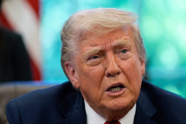 President Donald Trump speaks with reporters after signing executive orders in the Oval Office of the White House, Wednesday, April 23, 2025, in Washington. (AP Photo/Alex Brandon)