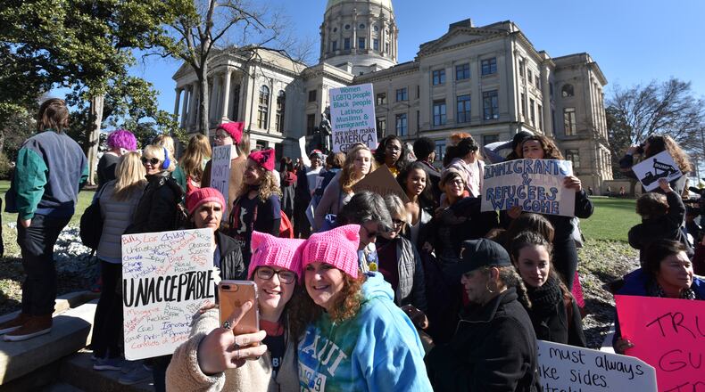Marchers gather outside the Capitol during the Women's March Atlanta and Power to the Polls rally on Saturday, January 20, 2018, marking the first anniversary of the historic Women's Marches held in Atlana and across the nation. The women's movement ignited by Donald Trump's election triggered a wave of political involvement from newly energized activists.